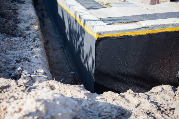 Professional Waterproofing technician working in Manassas, VA